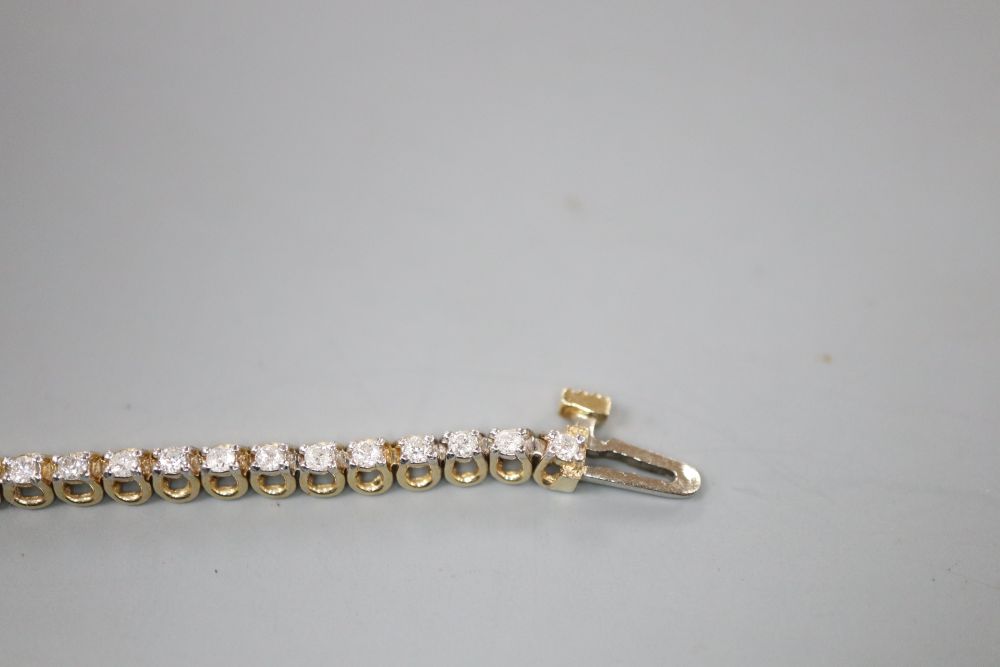 A modern 9ct gold and diamond set line bracelet, 17.7cm, gross 7 grams,